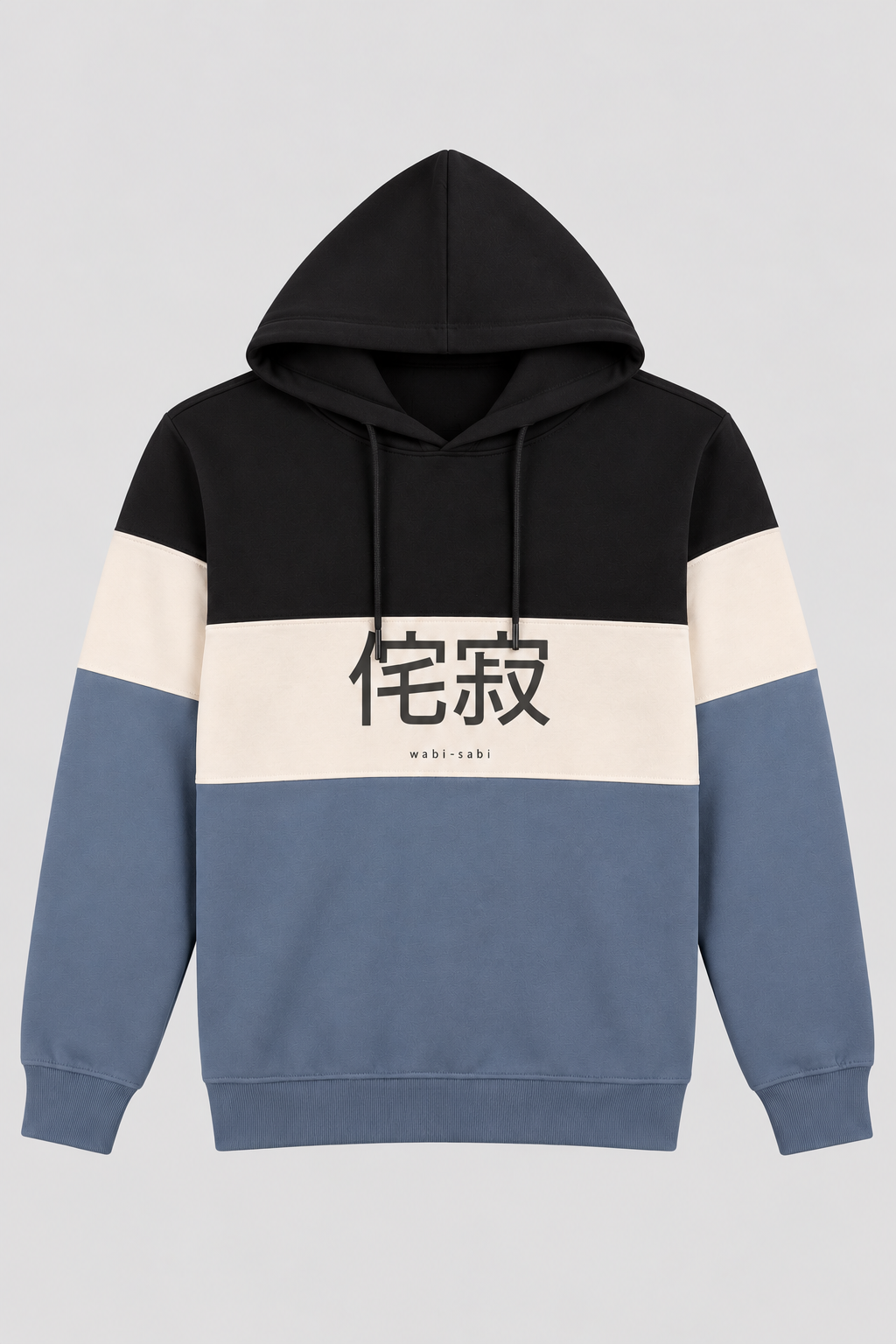 Black, ivory, and slate blue colour-block pullover hoodie with a drawstring hood, Japanese-inspired graphic and “wabi-sabi” text across the chest, and ribbed cuffs and hem.